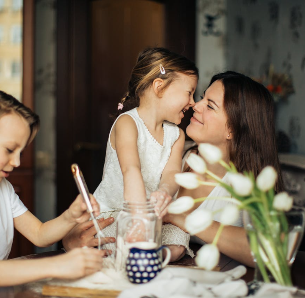 photo-of-woman-playing-with-her-children